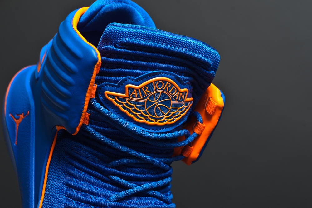 blue and orange air jordan with detail