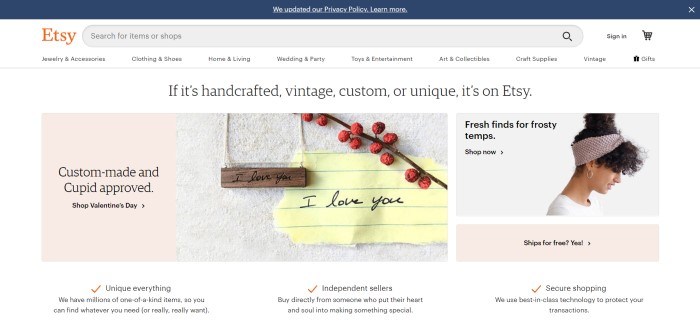 This screenshot of the home page for Etsy has a dark header above a white navigation bar and main section with a white background and product images with text describing them, including a wooden necklace and a woman's hair band being modeled by a woman with dark curly hair.