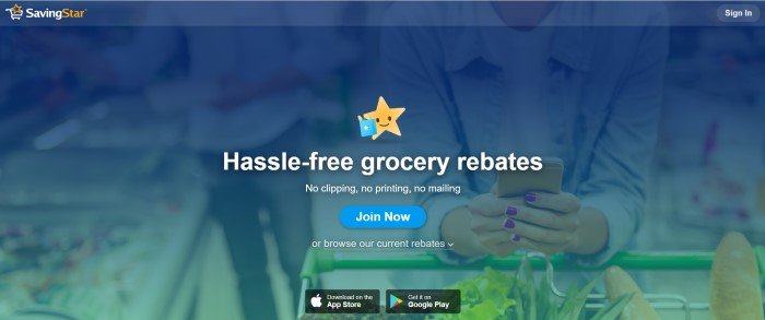 This screenshot of the home page for SavingStar has a dark blue filtered photo of a woman holding a cell phone as the background, along with a graphic of a yellow star with a blue shopping bag and white text announcing hassle-free grocery rebates, as well as a blue call-to-action button.