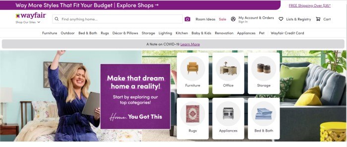 This screenshot of the home page for Wayfair has a purple header, a white search bar and navigation bar, and a photo of a smiling blonde woman in a blue robe sitting on a bed, holding a tablet and punching the air victoriously, along with several small product images and a purple ad section with white text.