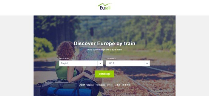 This screenshot of the home page for Eurail has a white header with a green and black logo, a gray background, and a large photo showing the back of a woman n a green shirt sitting near some blue bags next to a rail track running through a forest.