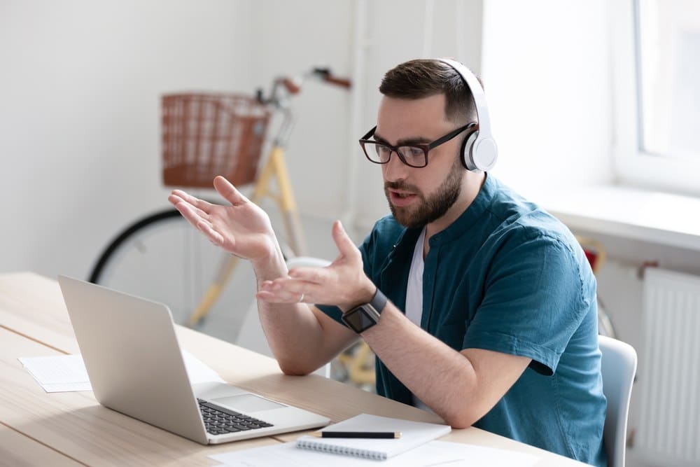 young man with beard taking online training course