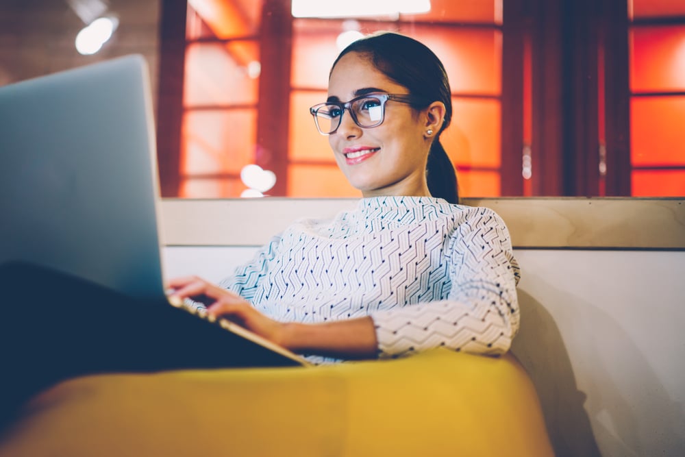 young woman blogging at night