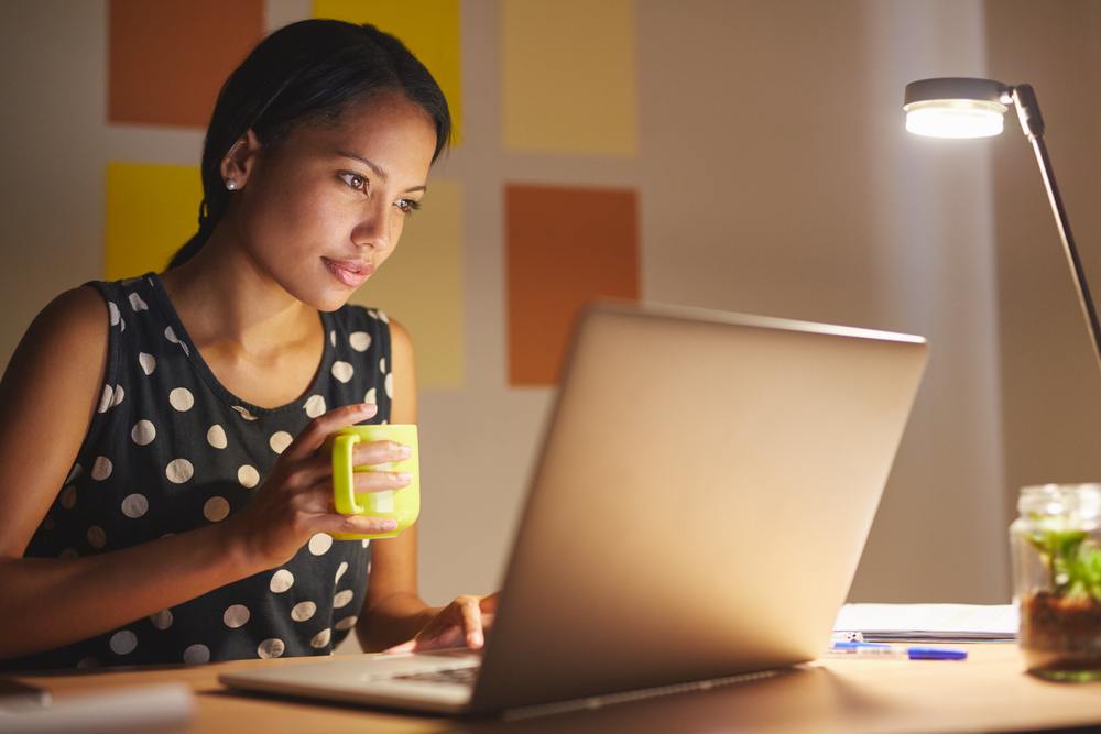 young woman working online at night