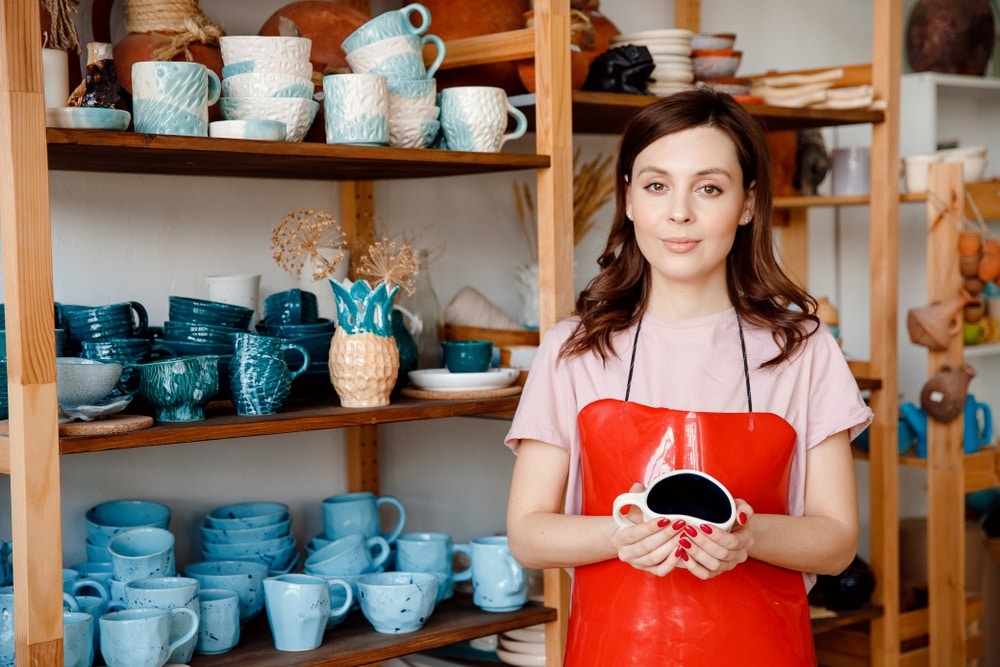 artisan craft ceramic maker with red apron