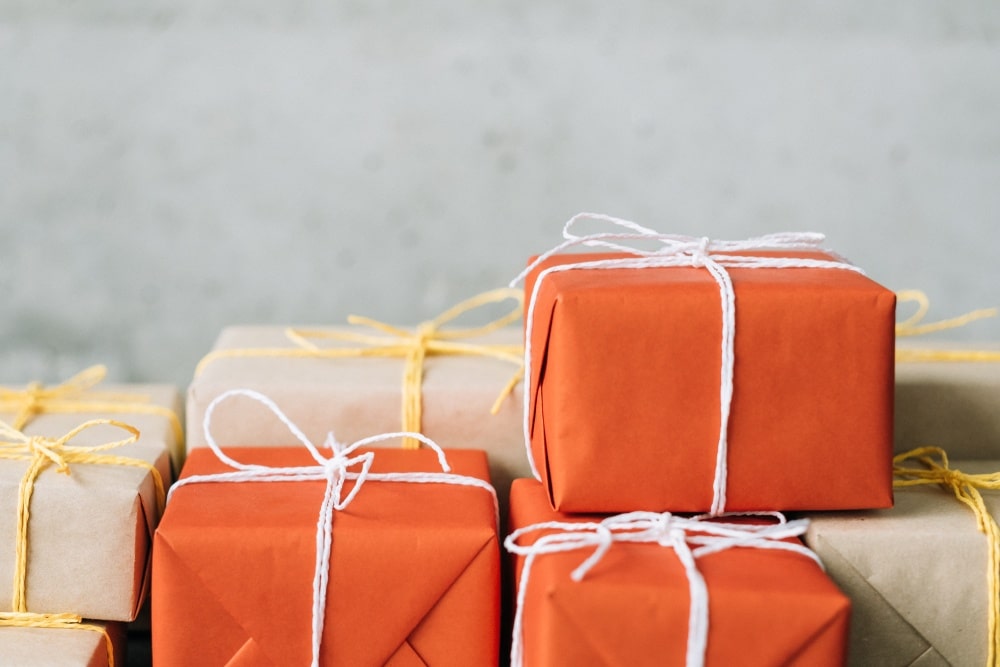 orange and tan boxes with handmade wrapping paper ready to ship