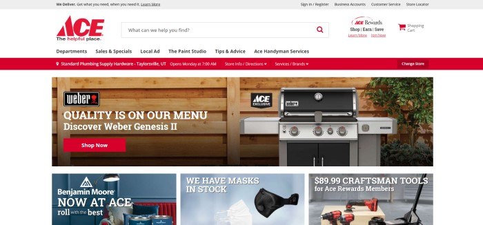 This screenshot of the home page for Ace Hardware has a gray header, a white navigation bar and search bar, a red announcement bar, and a white main section with a photo of a wooden wall with a large barbecue grill beside it, along with white text and a red call to action button, above a row of three smaller photos showing products the store carries, including face masks, drills, and paint.