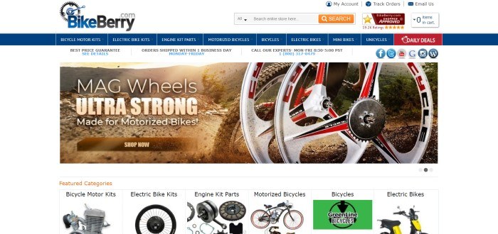 This screenshot of the home page for BikeBerry has a white header and search bar, a blue navigation bar with white text, a white announcement bar, a photo of motorized bike wheels as the bike drives up a dirt trail, above a row of photos with black text showing and labeling bicycle components.