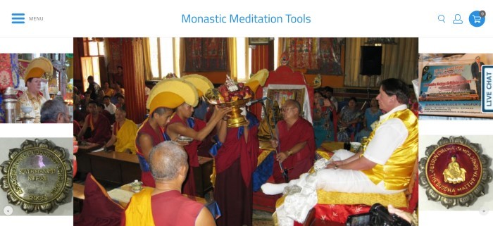 This screenshot of the home page for Shambhala Healing Tools has a white background, a large photo of some monks in red and blue clothing and yellow hats offering a golden fruit bowl to a man in white and gold clothing, and smaller photos of monastic life on the left and right sides of the page.