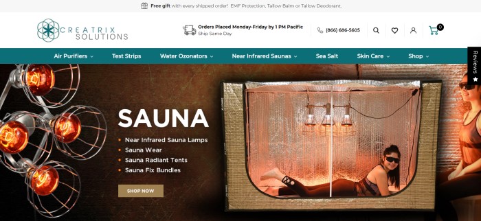 This screenshot of the home page for Creatrix Solutions has a gray header, a white announcement and logo section, and a teal navigation bar with white text above a large photo of a sauna with a woman in black clothing lying inside it on the right side of the page, a sauna lamp on the left side of the page, and white text with a brown call to action button.