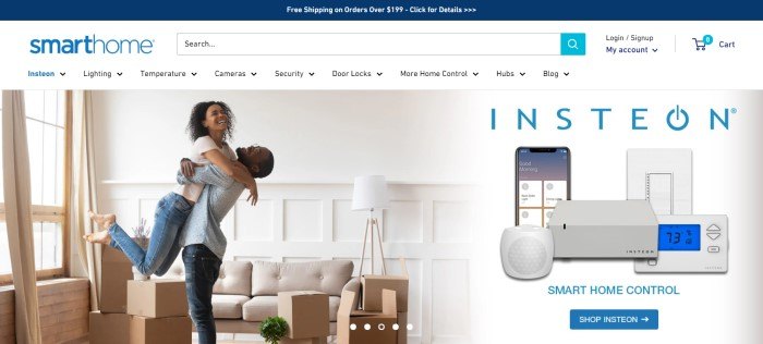 This screenshot of the home page for Smarthome has a blue announcement bar above a white search bar and navigation bar, along with a large photo of a smiling man and woman hugging in a white living room with a large window, a beige couch, and several boxes, next to a photo showing Smarthome equipment.