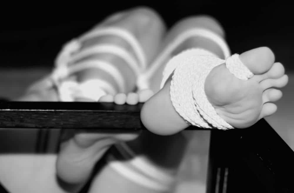 rope bound feet for foot fetish in black and white