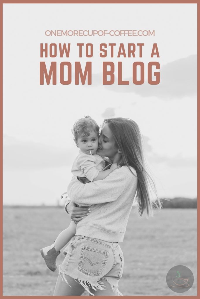 A black and white image of mom carrying her toddler in an open field, with text overlay "How To Start A Mom Blog"