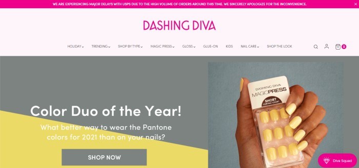 This screenshot of the home page for Dashing Diva has a magenta header, a magenta logo in a pale pink navigation bar with black text, and a large gray main section with a photo of a woman's hand on the right holding yellow press on nails, with a gray and black graphic section on the left behind white text and a gray call to action button.