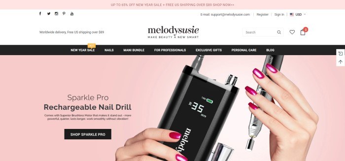 This screenshot of the home page for Melodysusie has a pink header, a white search bar, a black navigation bar, and a pink main section with black text, a black call to action button, and a woman's hands with pink fingernails holding a black nail drill.