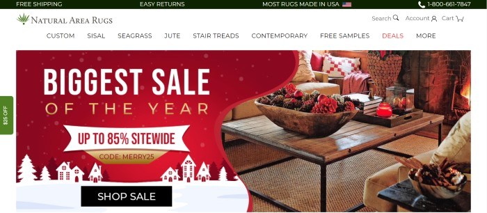 This screenshot of the home page for Natural Area Rugs has a black header with white text, a white navigation bar with black text, and a main section with a red, white, and gold graphic announcement section with a black call to action button on the left side of the main section and a photo of a wooden coffee table on a natural area rug in a comfortable living room on the right side of the main section.