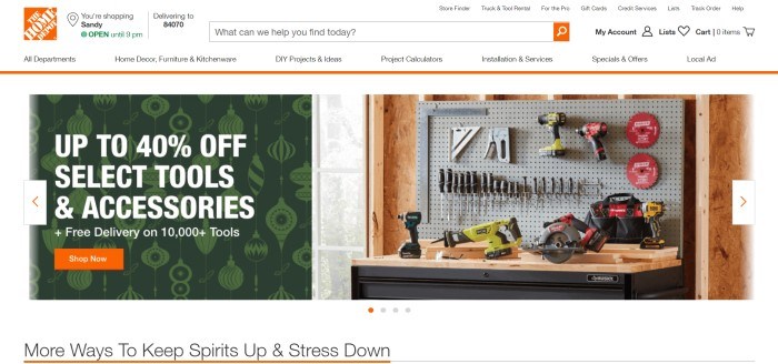 This screenshot of the home page for The Home Depot has a white header and navigation bar above a split main section with a photo of a tool bench and several tools hanging on the wall on the right side of the page and a green graphic section with white lettering on the left side of the page, along with an orange call to action button.