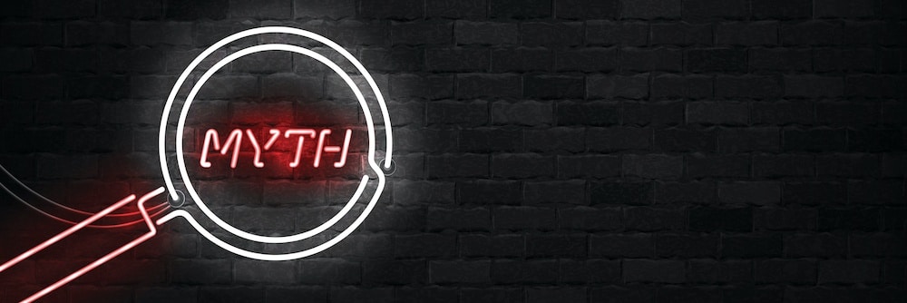 black brick wall with neon text "muth"