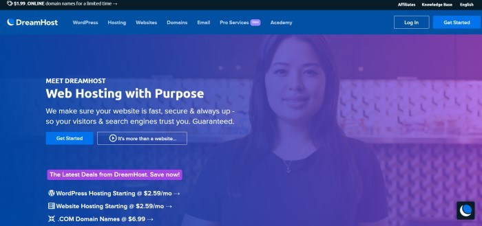 This screenshot of the home page for DreamHost has a black announcement bar and a blue filtered photo of a smiling woman as a background for the main section, behind white text, a blue call to action button, and a purple call to action button.