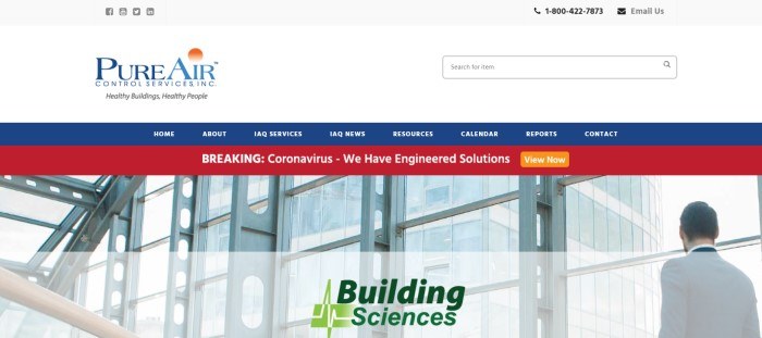 This screenshot of the home page for Pure Air Control Services has a white header and search bar, a blue navigation bar with white text, a red announcement bar with white text, and a large photo of an indoor office building with a man walking on the left side of the page, behind black and green text.