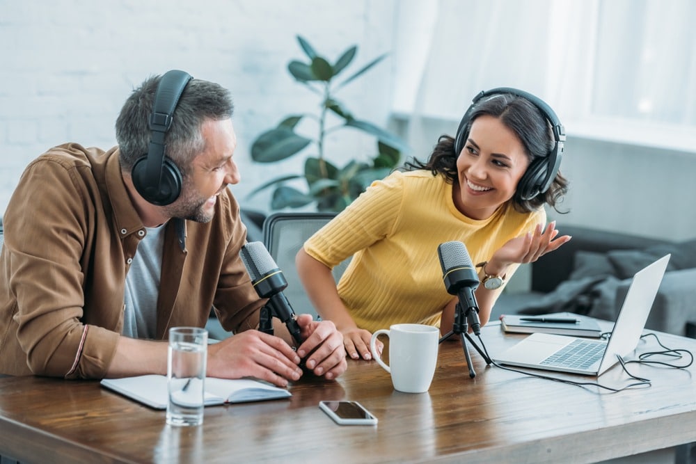 male and female podcast host having a conversation