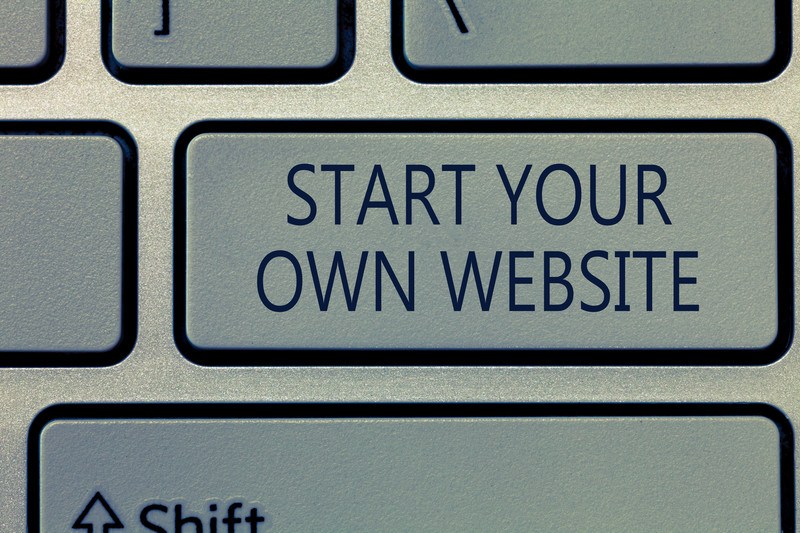 This photo shows a closeup of a key on a computer keyboard with the words 'Start your own website' on it, representing the best WordPress hosting affiliate programs.