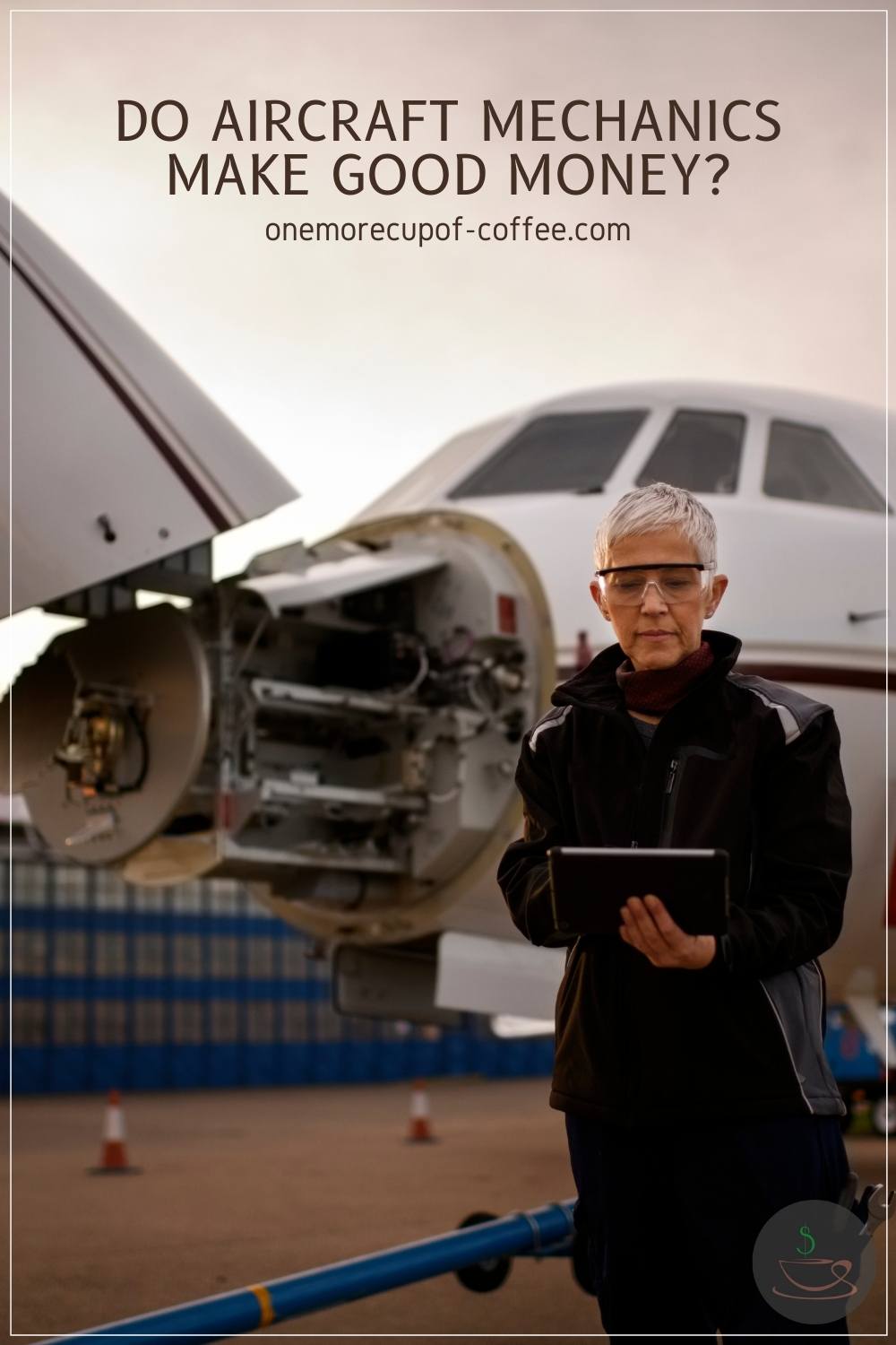 an aircraft mechanic checking on her records in front of an aircraft that is under maintenance