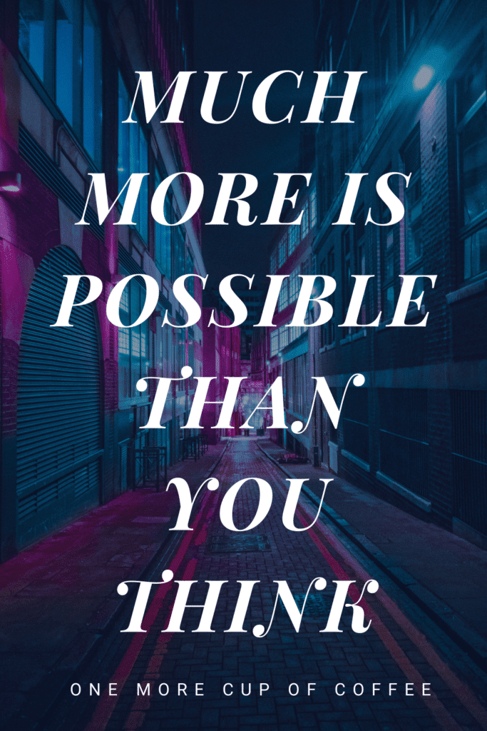 Much More Is Possible Than You Think text with blue and purple city street in the background