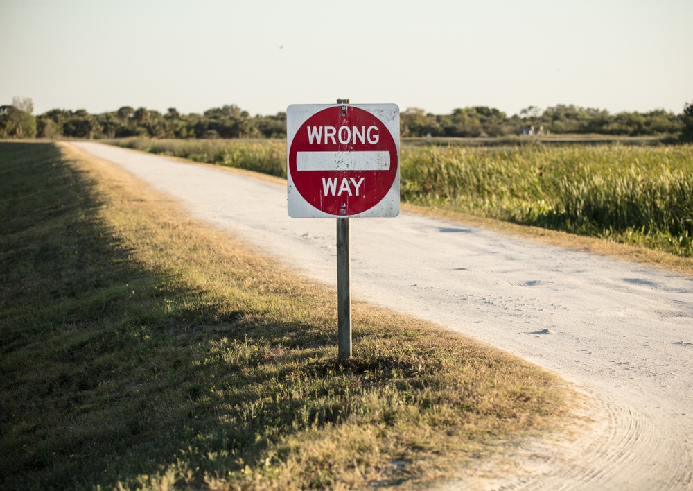 wrong way sign on dirt road