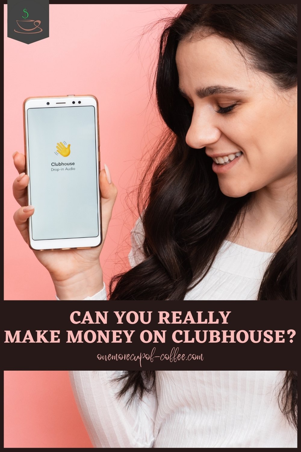 smiling woman wearing a white long-sleeved top with long black hair holding up a mobile phone with the Clubhouse app on it