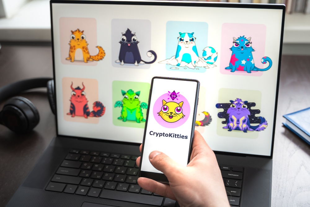 set of colorful cats with varying attributes shown on laptop screen