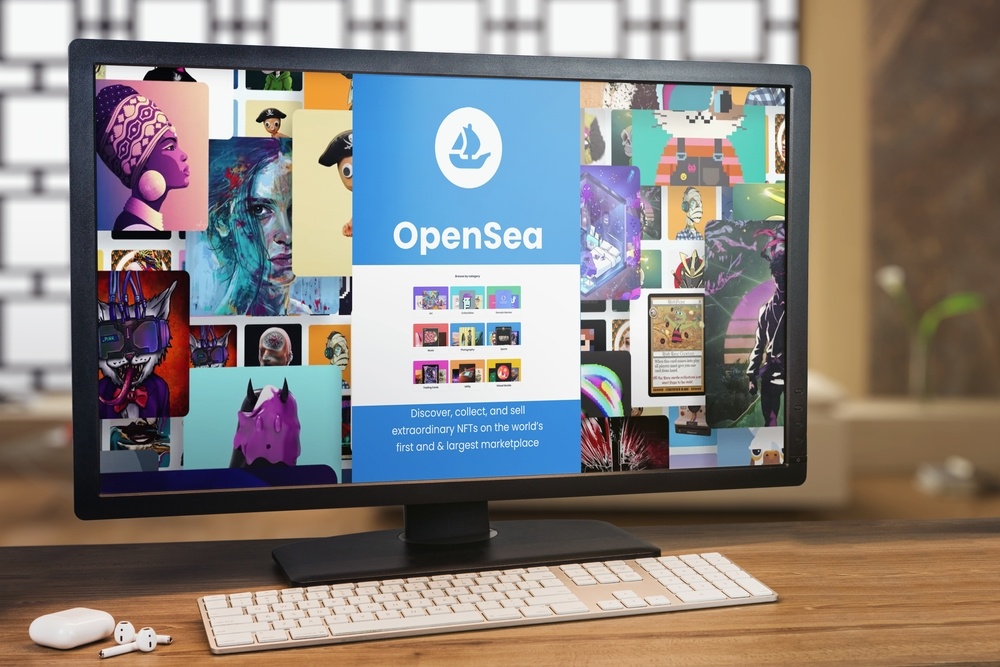 opensea website opened on internet browser on flat screen desktop monitor