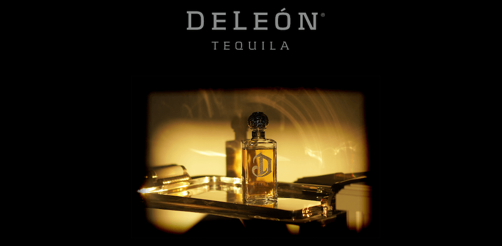 A bottle of Diddy's DeLeon Tequila sits on a silver tray.