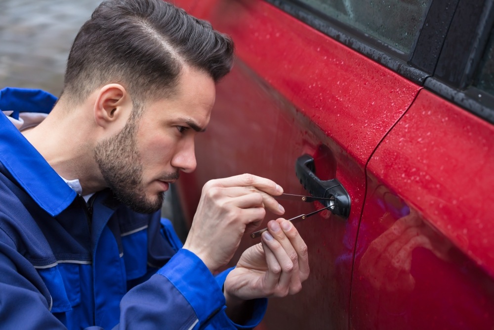 Locksmith picking a car lock