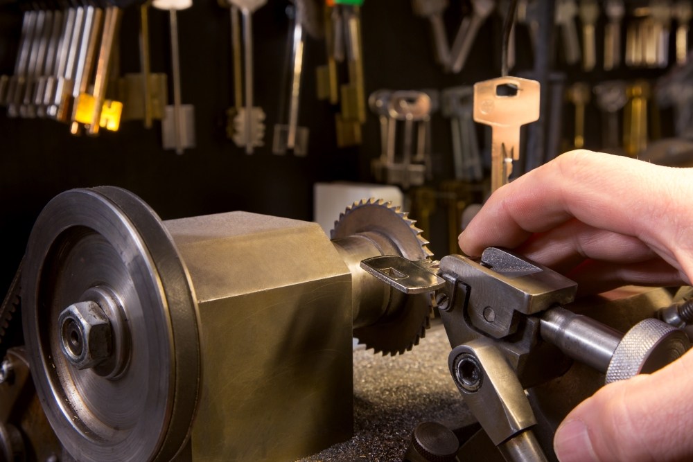 Locksmith working with a key machine