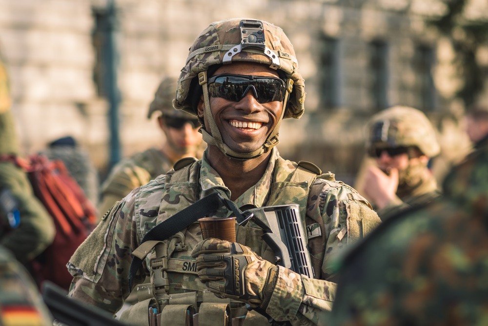 army veteran drinking a cup of coffee. veteran-owned coffee companies making coffee and employing US veterans