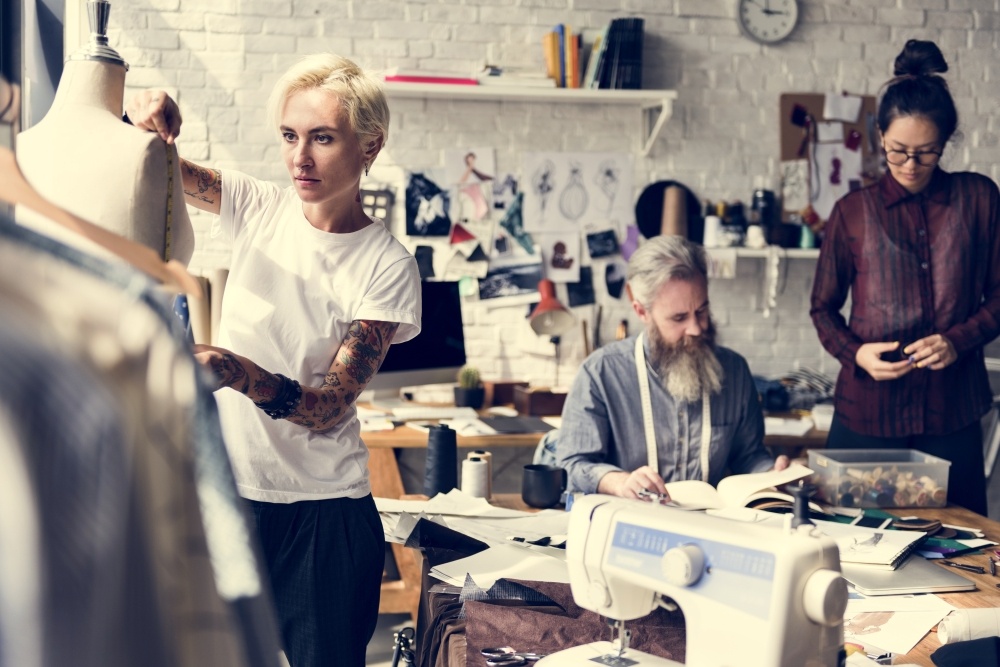 Group of people working on clothes