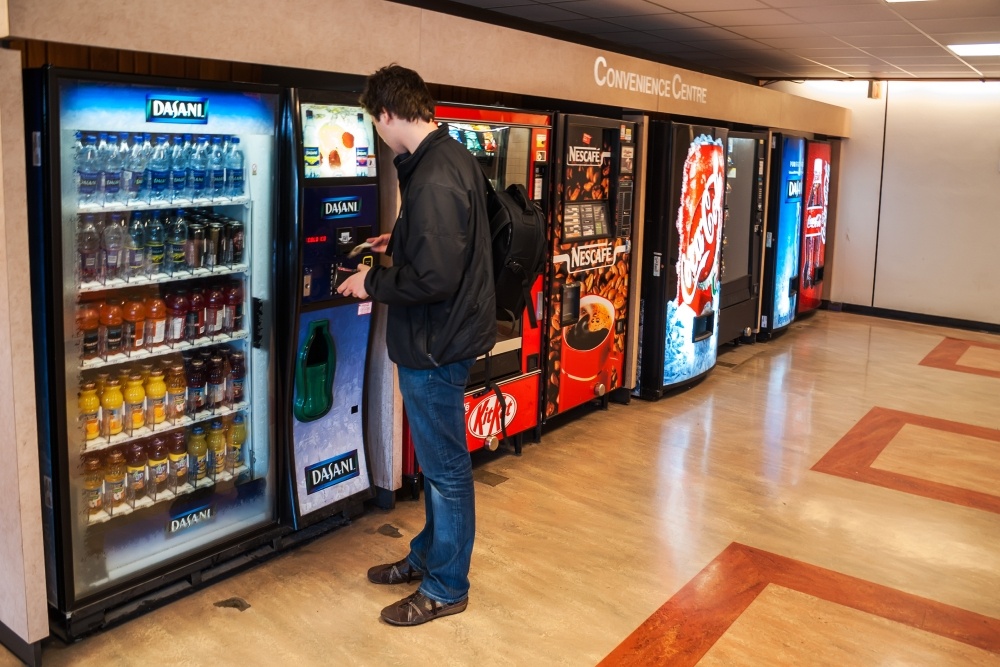 Man buying from a vending machine