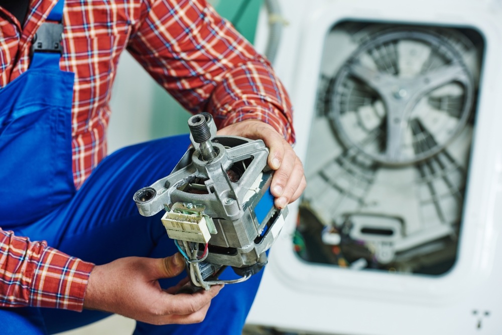 Person repairing a washing machine