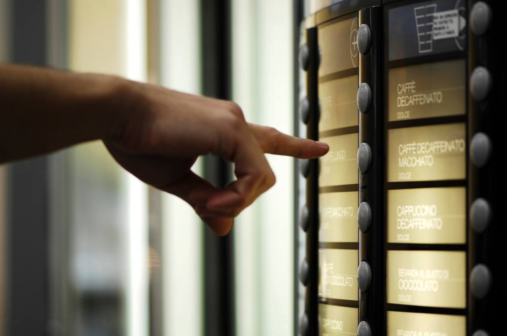 Pressing buttons on a vending machine