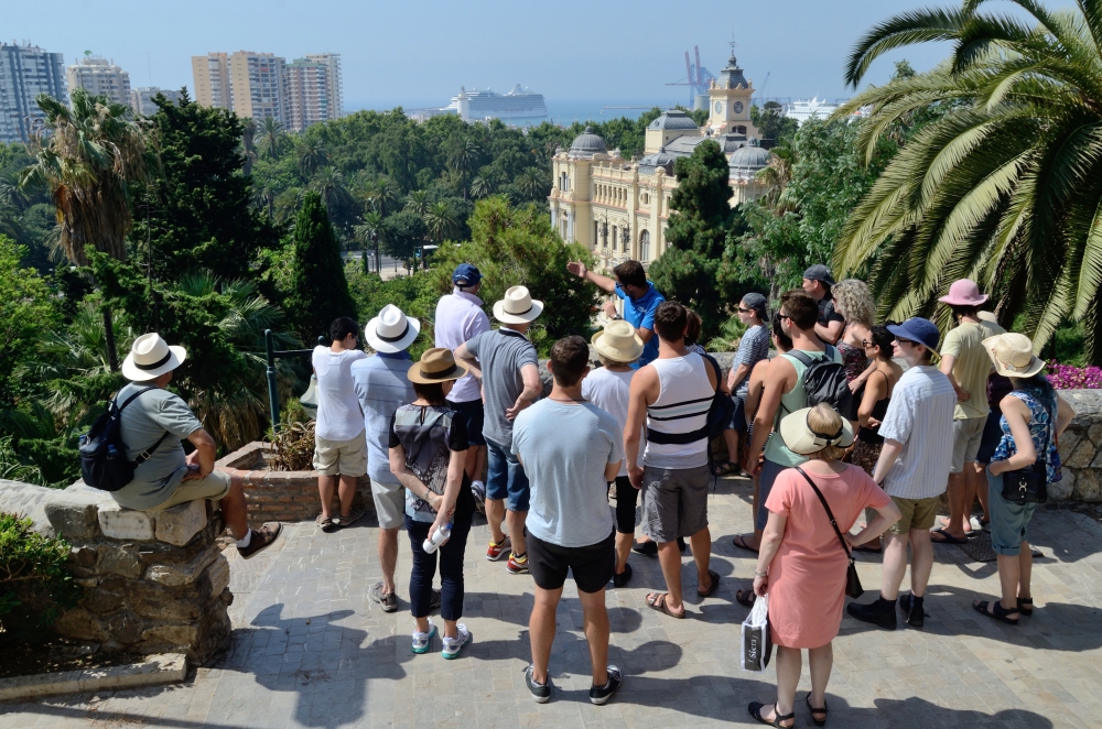 Tour guide leading a group of tourists