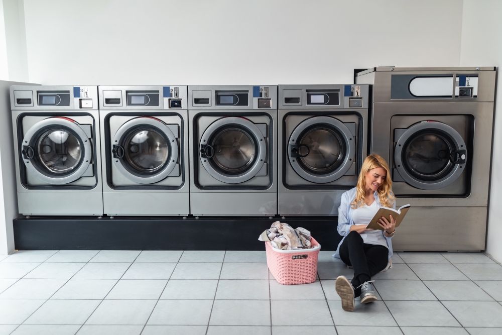 Woman waiting for laundry to finish