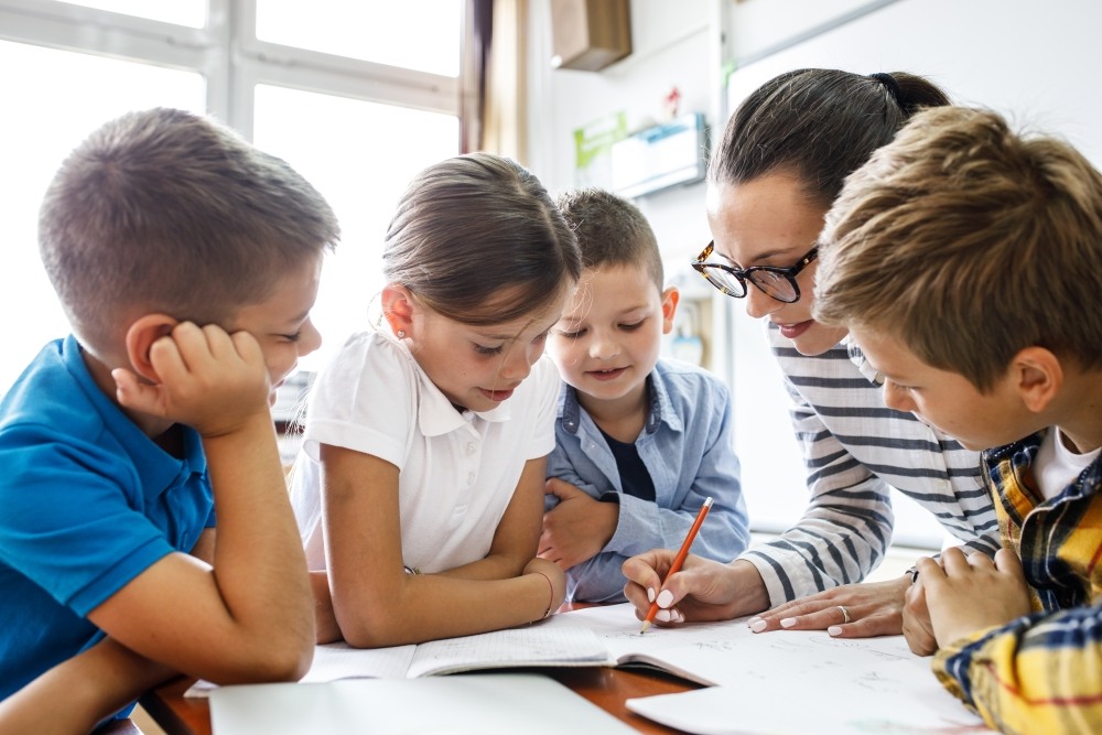 Teacher working with students