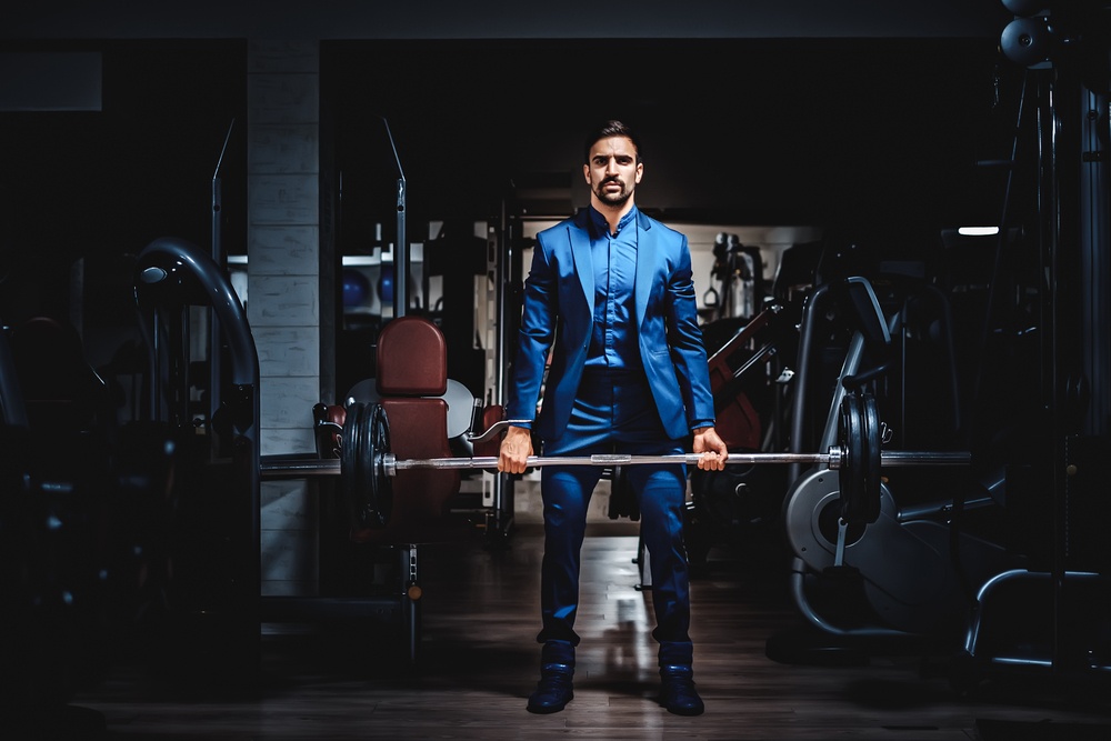 wealthy gym owner earning profit from a profitable gym