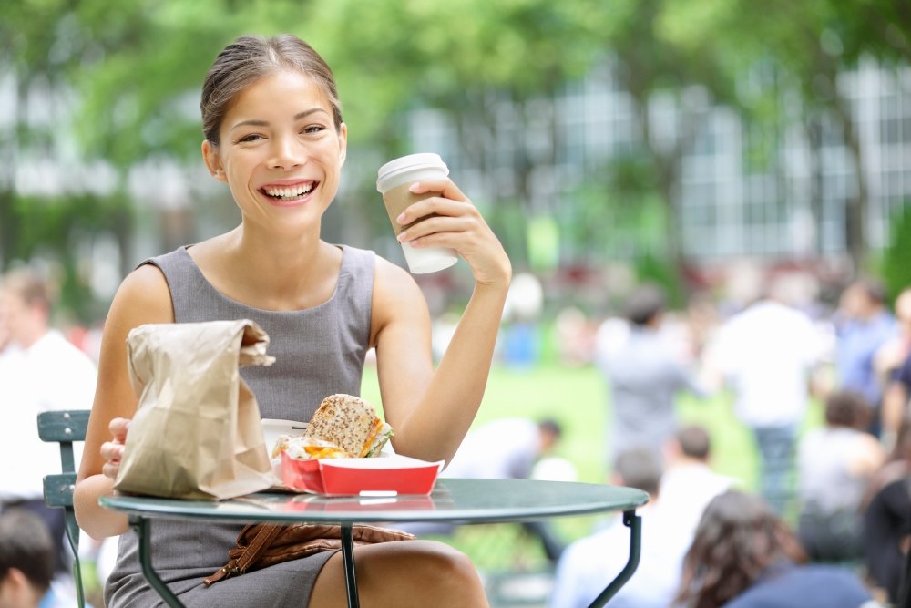 Woman eating outdoors